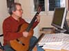 picture 1 :Ganesh composes in front of computer with the 6 string guitar (built by the luthier Alan Wilcox)